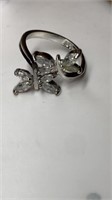 White stone butterfly ring marked RSC, size 5.5