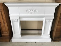 Small white painted wood fireplace surround