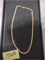 Gold colored necklace