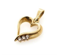 Diamond and 9ct yellow gold heart pendant