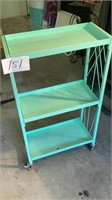 3 shelf metal storage on rollers, 22, by 10 1/2