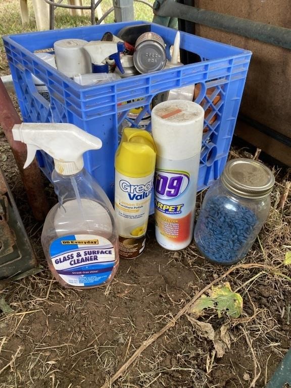 Crate of garage cleaners and chemicals