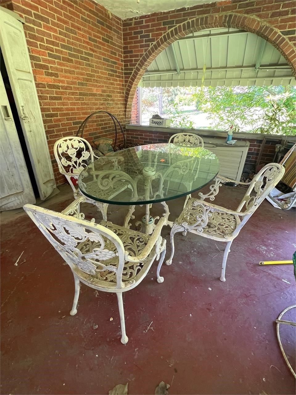 Vintage cast patio set with heavy duty glass table