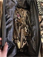 assorted wrenches in cloth tool bag