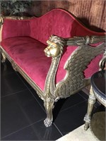 Carved wood settee with velvet seating winged