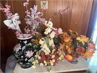 Floral arrangements in crystal baskets, vases,