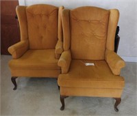 Pair of gold upholstered wingback chairs