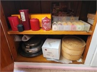 Shelf lot of misc candles steamer and more