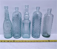 5 decorative green glass bottles
