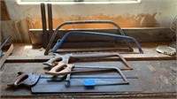 Antique metal squares, hand saws and modern hand