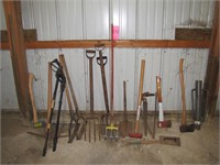 Group of 14+ hand tools: post drivers, axes, saws,