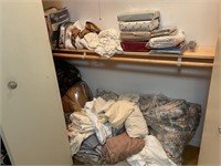 Closet  with sheets and shower curtain