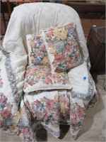 recliner covered in quilt, fabric is very worn