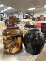 Pottery vase and brown bottle