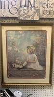 Large framed print of a little girl sitting on