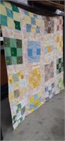 74 x 73 handmade quilt with staining and wear,