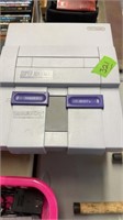 SUPER NINTENDO CONSOLE & GAMES IN PINK BASKET