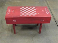 Painted wood red bench.