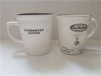 1 Starbucks and 1 tim hortons mug