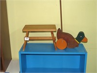 Child's Wooden Duck Push Toy and a Small Child's