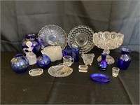 Assorted clear and cobalt blue glass