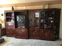Large cherry wood colored six section wall unit.