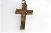 Silver cross engraved with birds and leaves
