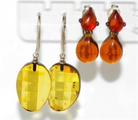 Two pairs of silver and amber earrings