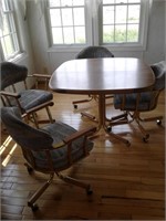 DINNING TABLE & 4 ROLLING CHAIRS