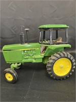 Ertl JD row crop tractor.  1/16 scale die cast