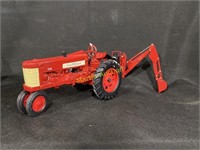 Farmall 350 tractor with back hoe hydraulic lift,