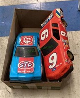 Two large plastic NASCAR replica cars features