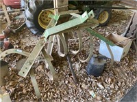 Three-point hitch cultivator. 53 inches wide