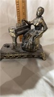 bronze? lady playing piano