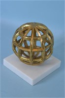 Gold Colored Globe on Stone Platform