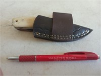 2-1/2"  Damascus steel knife, with leather sheath