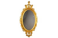 ANTIQUE OVAL CARVED GILTWOOD MIRROR