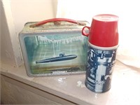 Early metal ship lunchbox with thermos