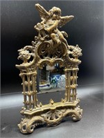 Vintage cast iron Cupid mirror