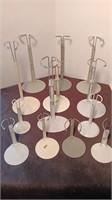 (14) 4” to 14” Metal Doll Stands.