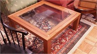 Contemporary oak coffee table with beveled glass