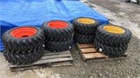 10-16.5 Skid Steer Tires and Rims (x4)