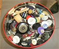round tin full of vintage buttons