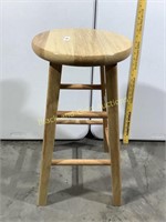 Light colored wooden round stool