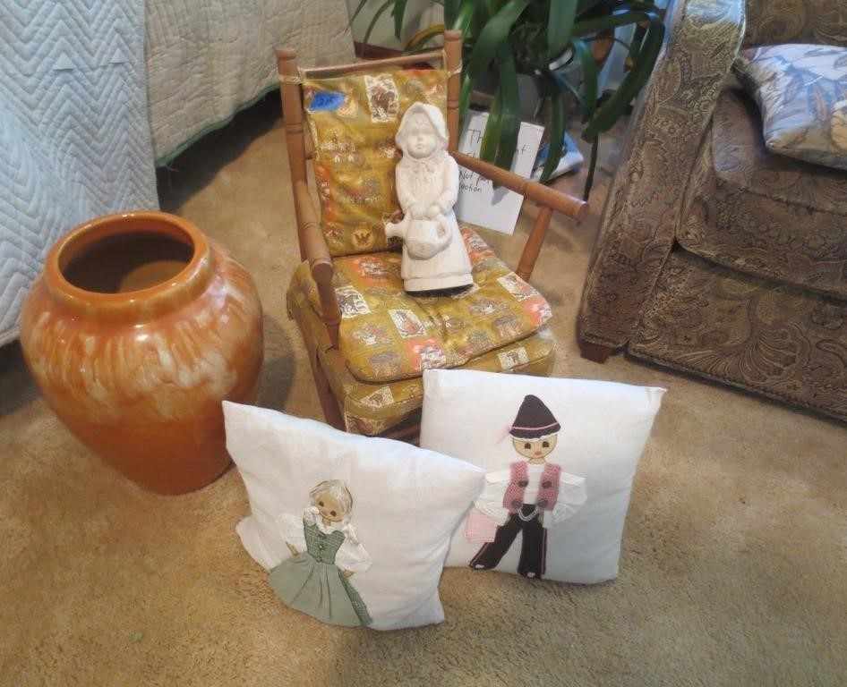 Vase, child's chair, pillows, figurine