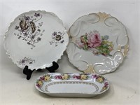 -2 plates with floral motif 1 marked Austria see