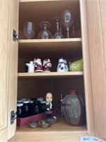 Contents of cabinet, glasses, coasters, vase,