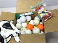 Box of golf items. Balls, glove, tees and more.
