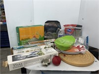 Lot of kitchen dishes and bags and wrap