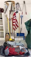 Tools including snow shovels, brooms, saws, pruner